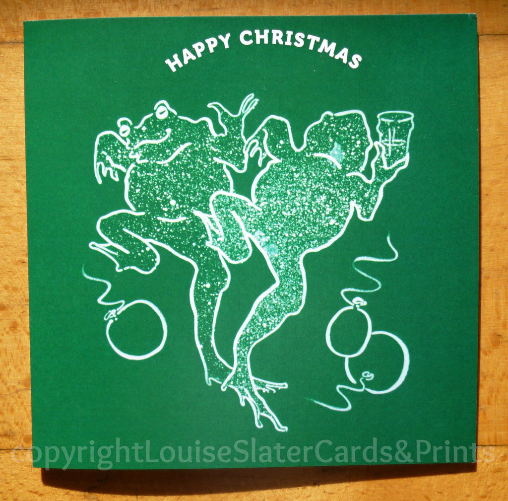 Green square Christmas card of dancing frogs: text "Happy Christmas"